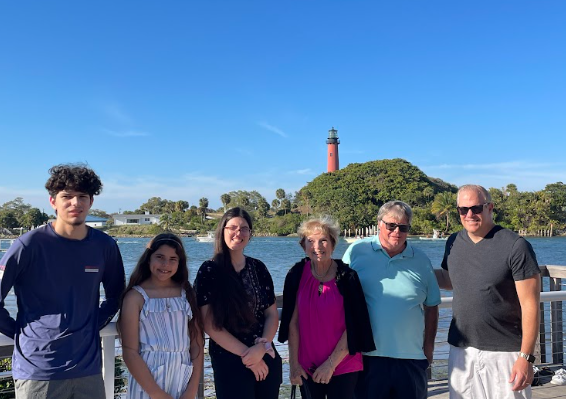 A picture of Bella Lomicka with her family of when she visited the Lighthouse.
